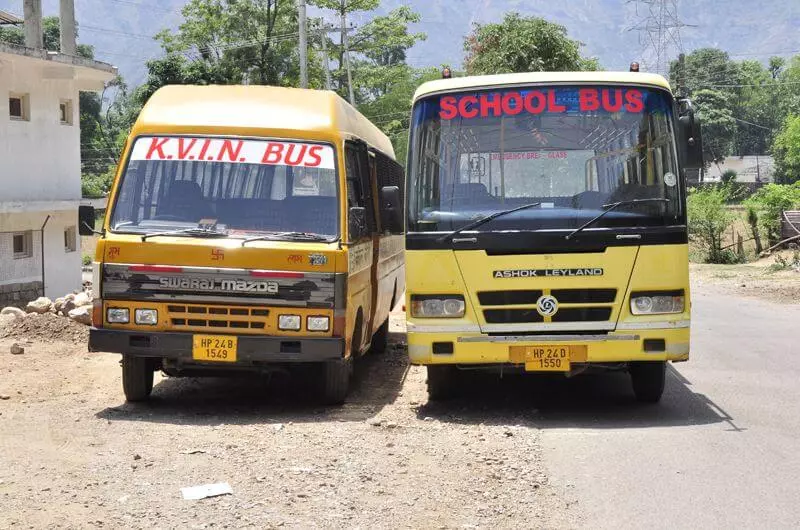 school buses parking in side of road